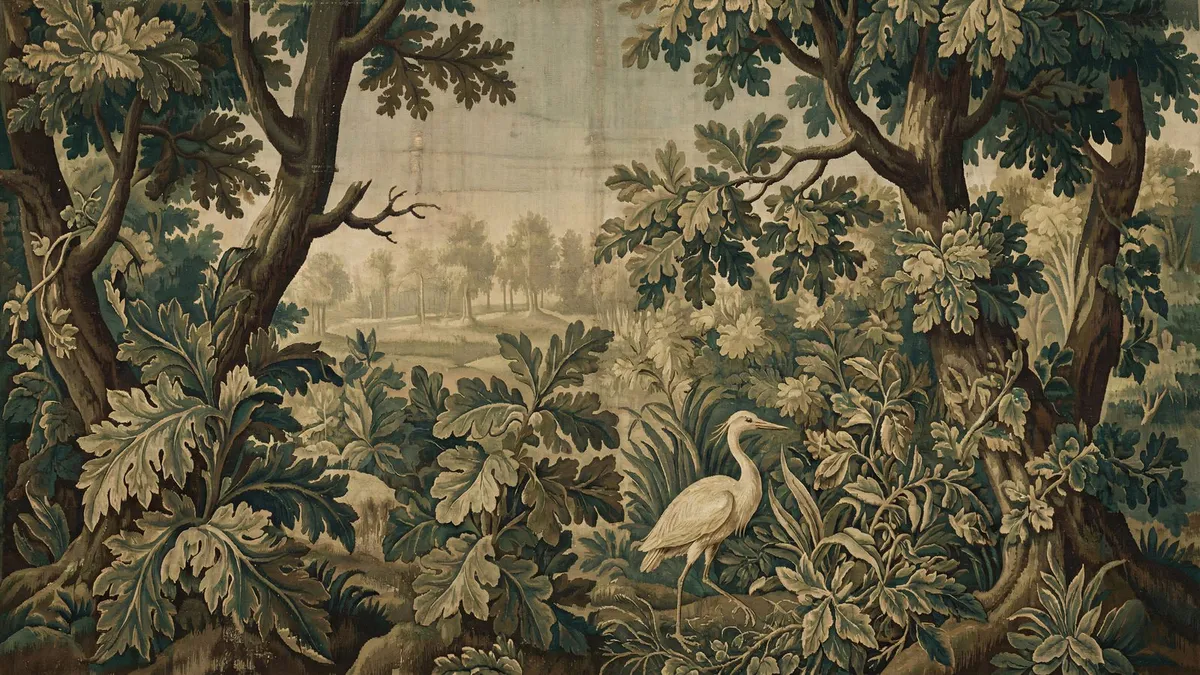 Woven tapestry of a white heron among oak trees and large leafy plants, with a distant sunlit clearing